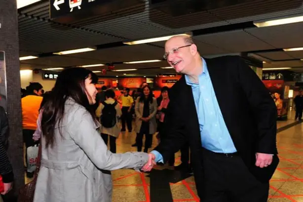 Jay Walder greets Hong Kong subway riders
